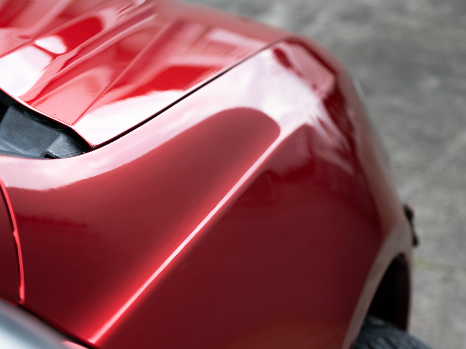 red car tail ceramic coating studio finish rosedale auckland